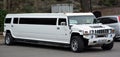 White limousine Hummer H1 in the city street.