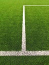 White line on artificial grass field on football playground. Detail of a cross of painted white lines in a soccer field. Royalty Free Stock Photo