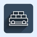 White line Cargo train wagon icon isolated with long shadow background. Full freight car. Railroad transportation. Blue Royalty Free Stock Photo