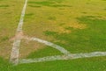 White line on corner flag post a soccer field grass