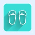 White line Flip flops icon isolated with long shadow. Beach slippers sign. Green square button. Vector Royalty Free Stock Photo