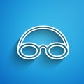 White line Glasses and cap for swimming icon isolated on blue background. Swimming cap and goggles. Diving underwater Royalty Free Stock Photo