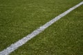 White line on green artificial turf soccer field Royalty Free Stock Photo