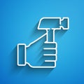 White line Hammer icon isolated on blue background. Tool for repair. Long shadow. Vector