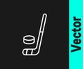 White line Ice hockey stick and puck icon isolated on black background. Vector Royalty Free Stock Photo