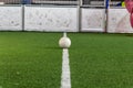 White line on indoor soccer field with football on the playground is ready for kick off as tournament or training Royalty Free Stock Photo