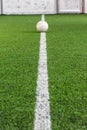 White line on indoor soccer field with football on the playground is ready for kick off as tournament or training Royalty Free Stock Photo