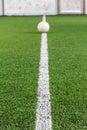 White line on indoor soccer field with football on the playground is ready for kick off as tournament or training Royalty Free Stock Photo