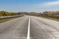 White line in middle of winding deserted asphalt road or highway.Travels.Autumn Country landscape Royalty Free Stock Photo