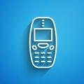 White line Old vintage keypad mobile phone icon isolated on blue background. Retro cellphone device. Vintage 90s mobile Royalty Free Stock Photo