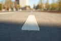 White line perspective. Road marking on street background in blur