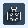 White line Photo camera icon isolated with long shadow background. Foto camera. Digital photography. Blue square button Royalty Free Stock Photo