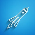 White line Rocket ship with fire icon isolated on blue background. Space travel. Long shadow Royalty Free Stock Photo