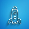 White line Rocket ship icon isolated on blue background. Space travel. Long shadow. Vector