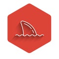 White line Shark fin in ocean wave icon isolated with long shadow background. Red hexagon button. Vector Royalty Free Stock Photo