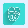 White line Slippers icon isolated with long shadow. Flip flops sign. Green square button. Vector Royalty Free Stock Photo