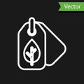 White line Tag with leaf symbol icon isolated on black background. Banner, label, tag, logo, sticker for eco green Royalty Free Stock Photo
