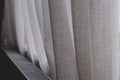 White linen curtain heating metal radiator background