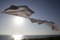 White linens on rope on sunset background