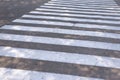 White lines of a pedestrian crossing. Road safety. Crossing transition, zebra, danger on the road, attentive path