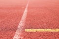 White lines and texture of running racetrack, red rubber racetracks in small stadium Royalty Free Stock Photo