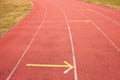 White lines and texture of running racetrack, red rubber racetracks in small stadium Royalty Free Stock Photo