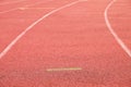 White lines and texture of running racetrack, red rubber racetracks in small stadium Royalty Free Stock Photo