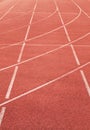 White lines and texture of running racetrack, red rubber racetracks in small stadium Royalty Free Stock Photo