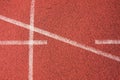 White lines and texture of running racetrack, red rubber racetracks in small stadium Royalty Free Stock Photo