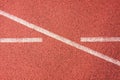 White lines and texture of running racetrack, red rubber racetracks in small stadium Royalty Free Stock Photo