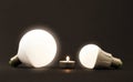 White little candle and LED electric bulbs on dark background. C