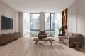 White living room home library interior with couch, bookcase, armchair and TV Royalty Free Stock Photo