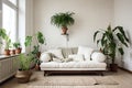 white living room with a single green potted plant and a simple couch