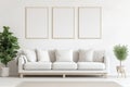 White living room with sofa and three empty picture frames on the wall Royalty Free Stock Photo