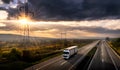 White lorry on a highway at sunset