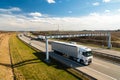 White lorry passing toll gate on Prague Circuit, Czech republic