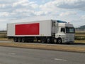 White lorry with red banner