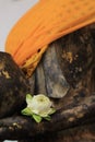 White lotus fold blooming on hand of Buddha disciple statue