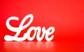 White LOVE sign on a red background