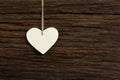 White Love Valentine's heart hanging on wooden texture backgroun Royalty Free Stock Photo