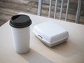 White lunch box with paper cup of coffee. 3d rendering Royalty Free Stock Photo