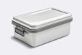 White Lunch Box Resting on Top of Table Royalty Free Stock Photo