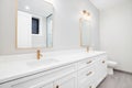 White luxurious bathroom with gold accents. Royalty Free Stock Photo