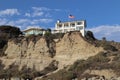 White luxury home on seaside cliffs in San Clemente, California, USA with a flag in front of it Royalty Free Stock Photo