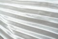 White luxury satin fabric folds background. Rippled white silk fabric satin cloth gathers glamour background. Smooth elegant white