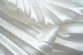 White luxury satin fabric folds background. Rippled white silk fabric satin cloth gathers glamour background. Smooth elegant white