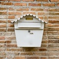 White Mail Box in Front of wall