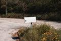 A white mailbox on the side of the road Pesaro, Italy Royalty Free Stock Photo