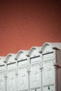 White mailboxes on an orange wall Royalty Free Stock Photo