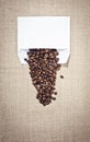 White mailing envelope and coffee beans. Invitation for a Cup of coffee